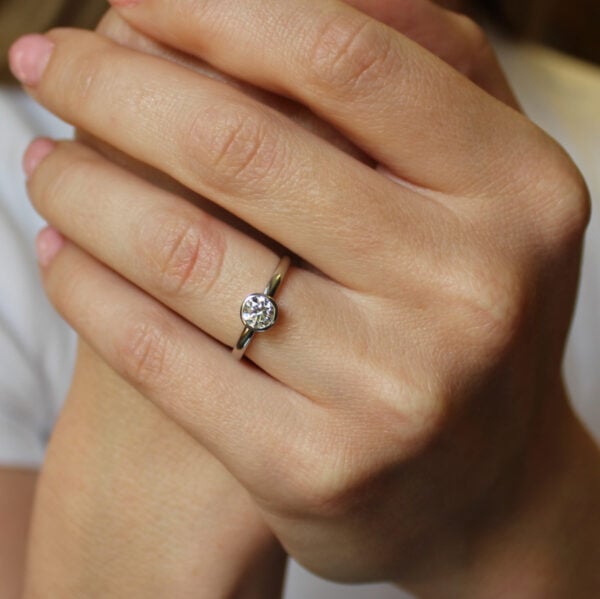The Aise: 14ct White Gold Round Diamond Solitaire Bezel Set Engagement Ring