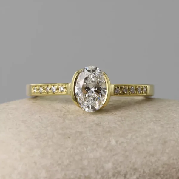 The Faughan: 18ct Gold Partial Collet Oval Diamond or Moissanite Engagement Ring with Pave Set Shoulders