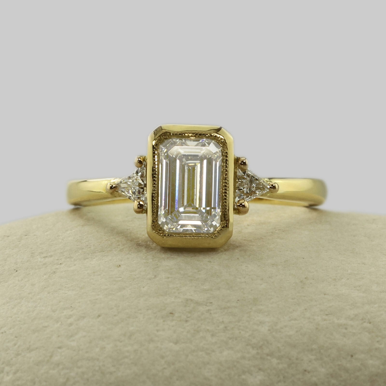 Handmade 18ct yellow gold emerald cut diamond trilogy engagement ring